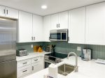 Fully equipped kitchen with electric range
